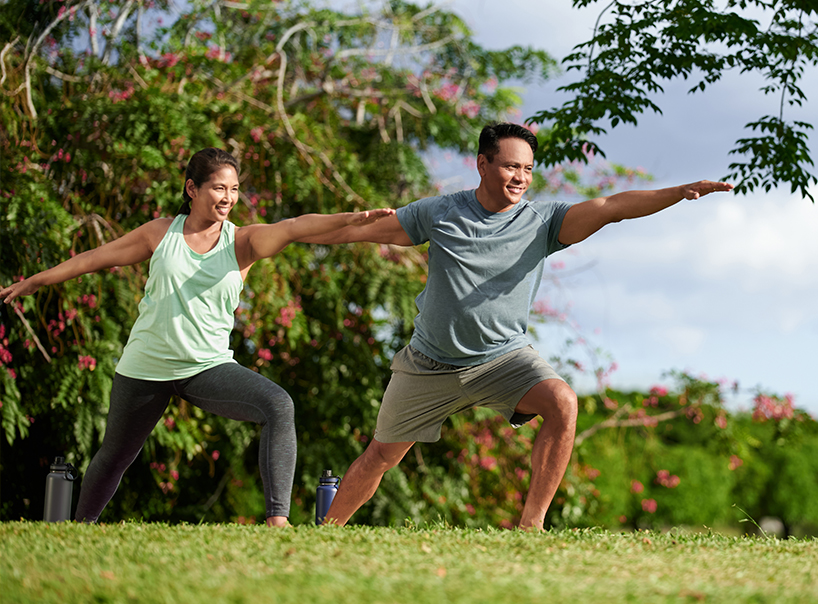 Couple exercising at a Koa Ridge park